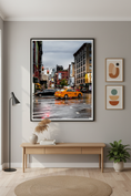 Load image into Gallery viewer, Yellow New York City taxi turning at a rainy street intersection in Manhattan