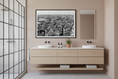 Load image into Gallery viewer, Bathroom with wooden vanity, two sinks, and a cityscape print on the wall.