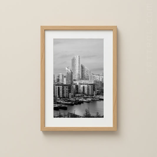 Framed black and white cityscape of Canary Wharf London print on a beige wall