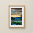 Load image into Gallery viewer, Framed artwork of a landscape with a sunset over mountains on a beige wall.
