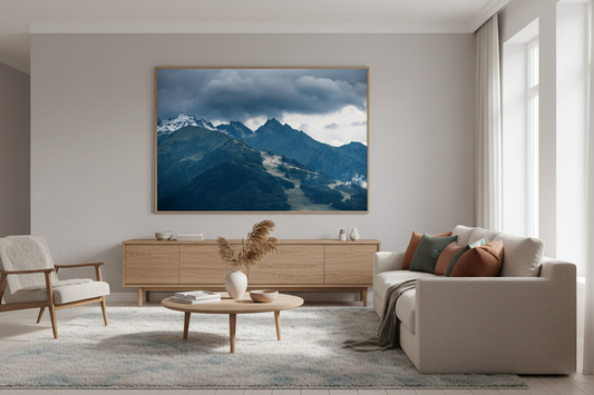 Moody alpine mountain range under dark storm clouds, fine art wall print.