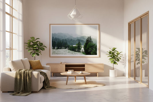 Modern living room with a large window, sofa, coffee table, and decorative plants.