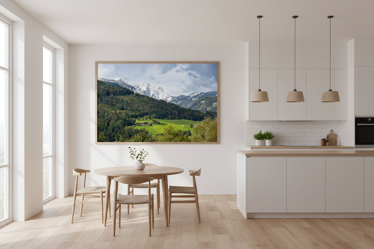Modern kitchen with a scenic mountain view painting on the wall
