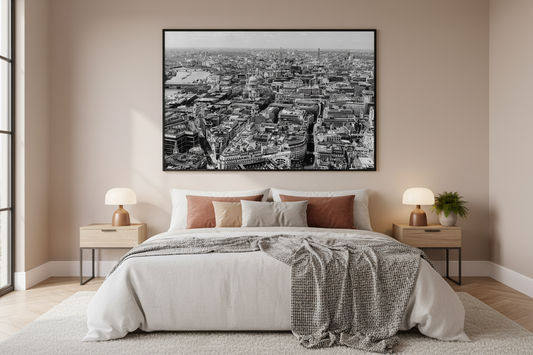 Bedroom with a large framed cityscape print on the wall