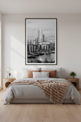 Load image into Gallery viewer, Modern bedroom with a large framed black and white cityscape print on the wall.
