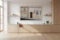 Load image into Gallery viewer, Modern kitchen with wooden cabinets and a framed photograph on the wall.

