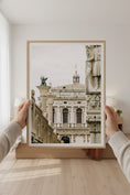 Load image into Gallery viewer, Framed photograph of an architectural building held by a person indoors.
