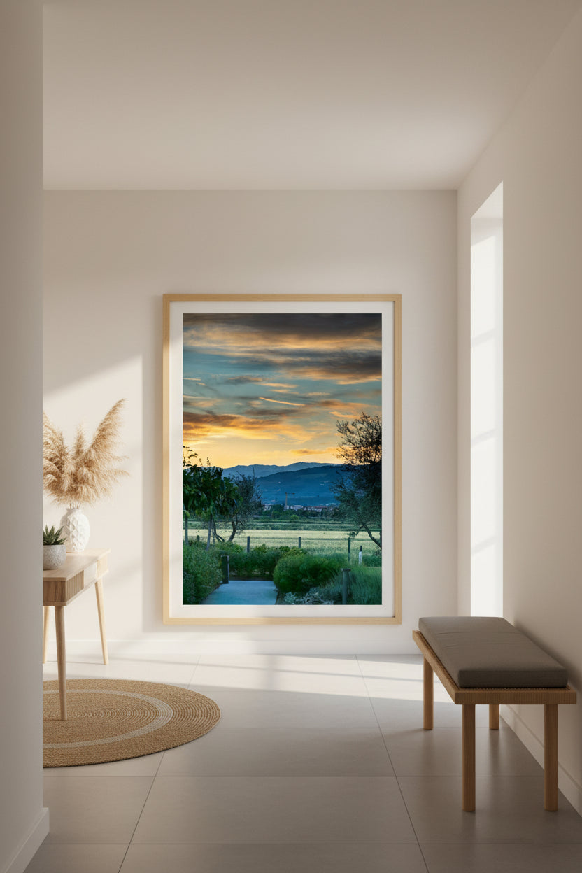 Framed landscape painting in a modern interior setting with a bench and decor items.