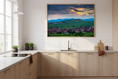 Load image into Gallery viewer, Vibrant sunset over French wine country with green fields and traditional village houses.
