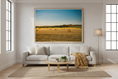 Load image into Gallery viewer, Peaceful countryside landscape showing hay bales and farmland in warm evening light
