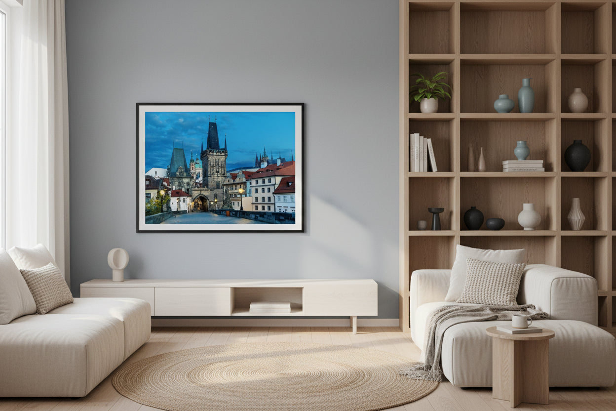 Modern living room with a cityscape painting on the wall, wooden bookshelf, and white furniture.