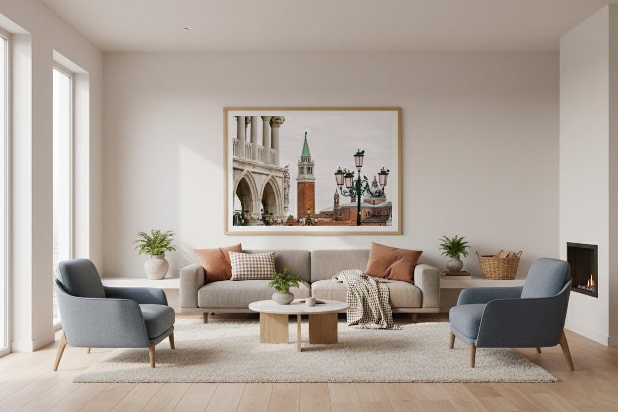 Modern living room with gray sofa, blue armchairs, and a cityscape artwork on the wall.