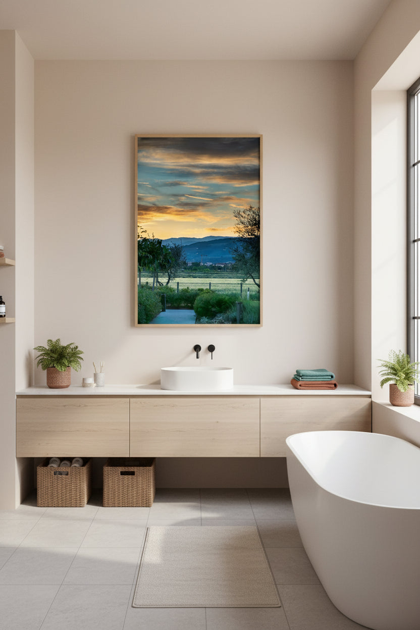 Modern bathroom with a large framed picture on the wall, a sink, and a freestanding bathtub.