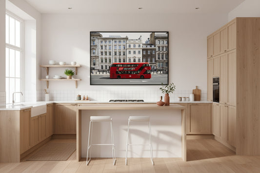 Red double-decker bus passing Westminster architecture in central London under soft daylight
