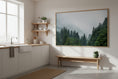 Load image into Gallery viewer, Modern kitchen with a large framed picture of a forest on the wall.
