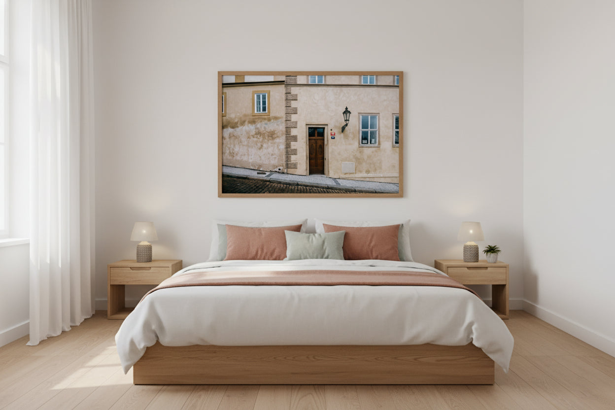 Bedroom with wooden bed, nightstands, and a framed picture on the wall.