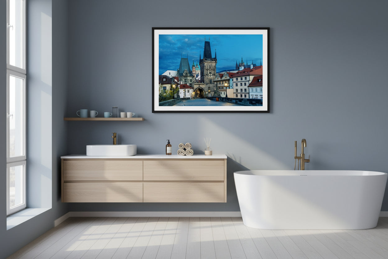 Modern bathroom with a framed picture of a cityscape on the wall.