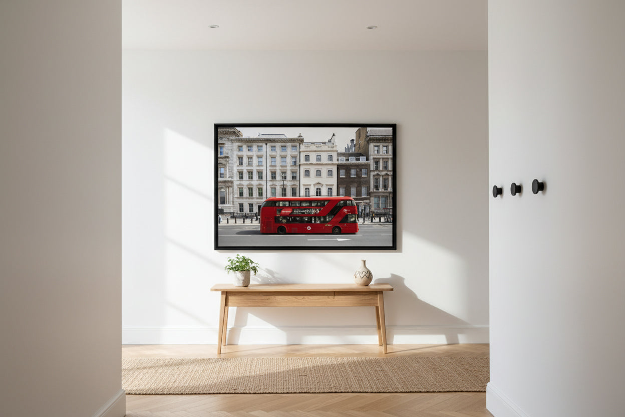 Iconic red double-decker bus on a London street framed by traditional white stone facades — modern cityscape print.