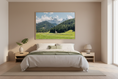 Load image into Gallery viewer, Bedroom with a large landscape painting of mountains on the wall
