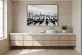 Load image into Gallery viewer, Bathroom with wooden vanity, white countertop, and framed artwork on the wall.
