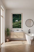 Load image into Gallery viewer, Alpine pasture with grazing cow, showcasing natural beauty and mountain tranquility.

