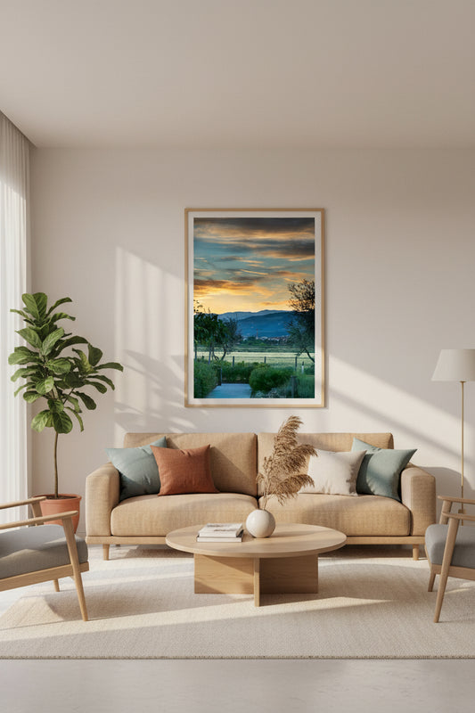 Modern living room with beige sofa, coffee table, and framed artwork on the wall.