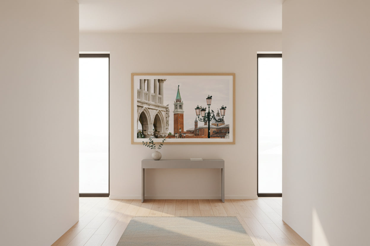 Modern interior with a framed picture of a cityscape on a wall.