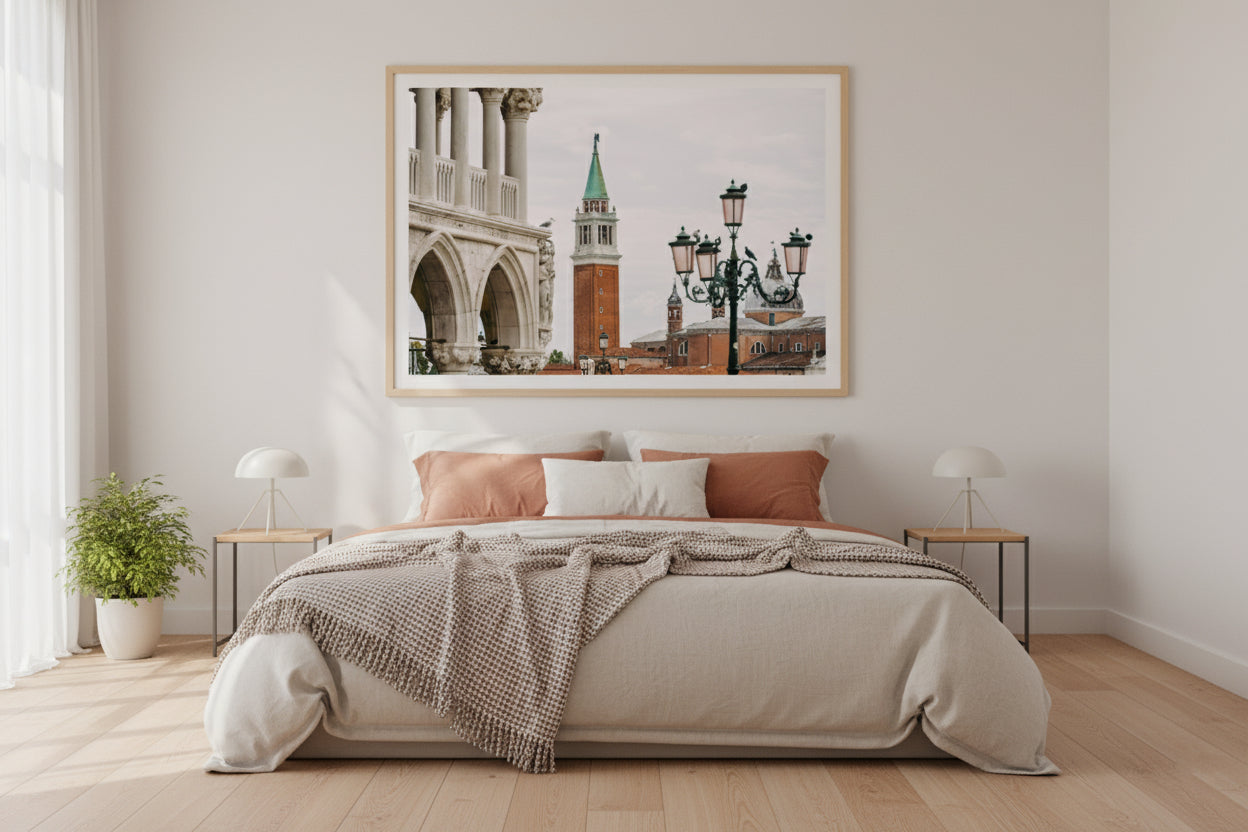 Bedroom with a large framed photograph of a cityscape on the wall above the bed.
