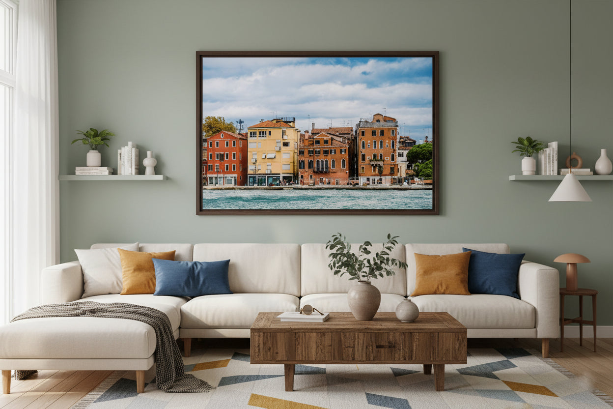 Living room with a sectional sofa, coffee table, and wall art of a cityscape.